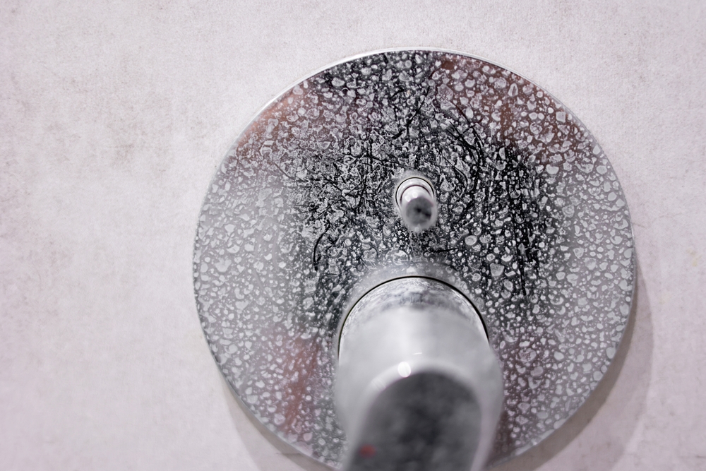 limescale on the handle of a shower