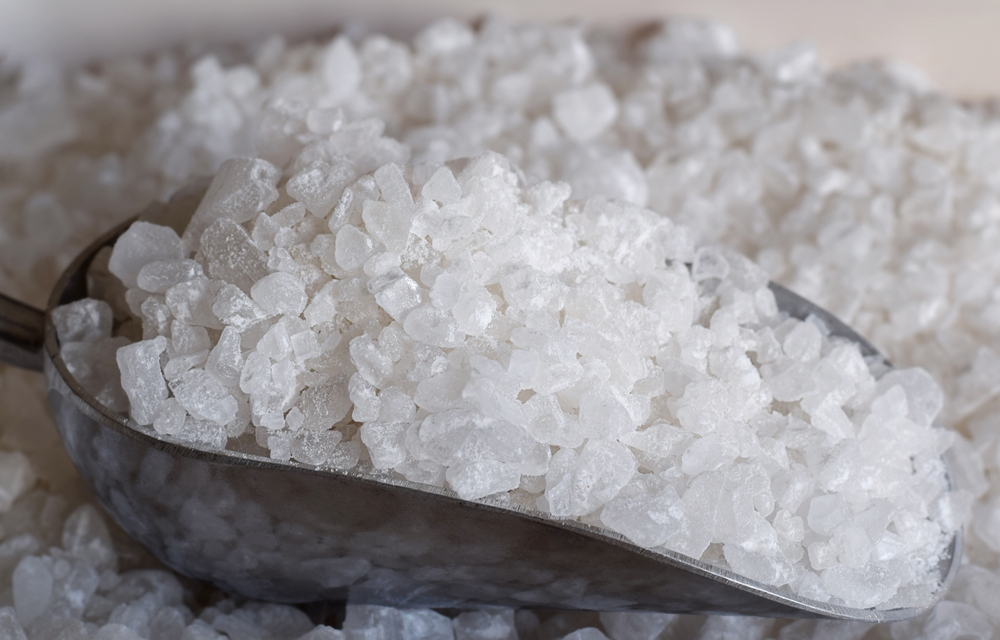 a large scoop of water softener salt crystals